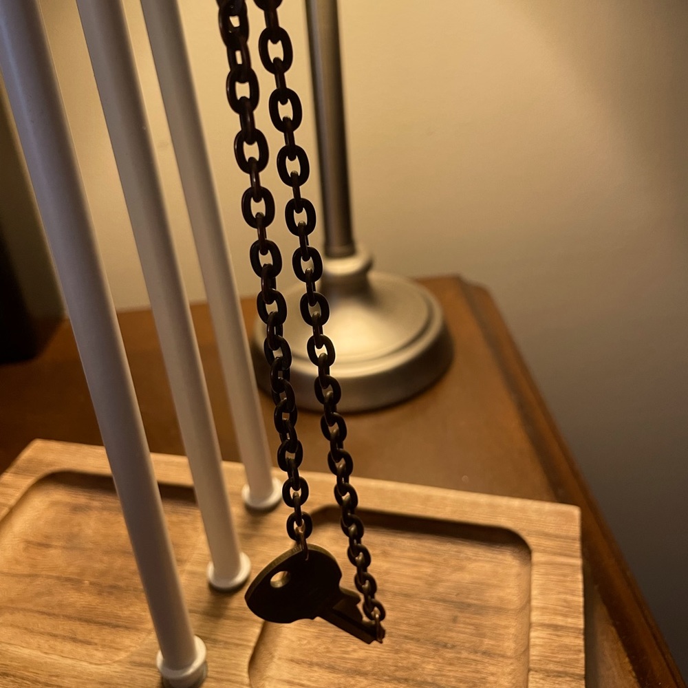 Tribe Kelley original key necklace. Says “tribe”